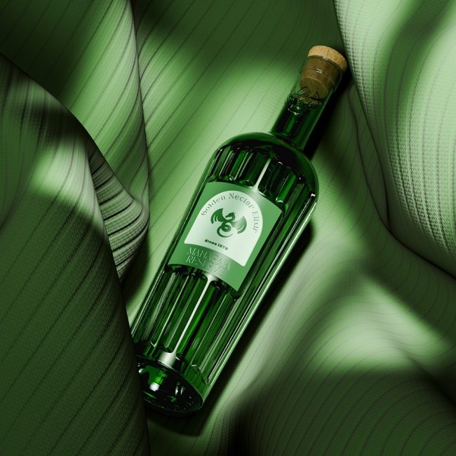 a bottle of wine sitting on top of a green couch